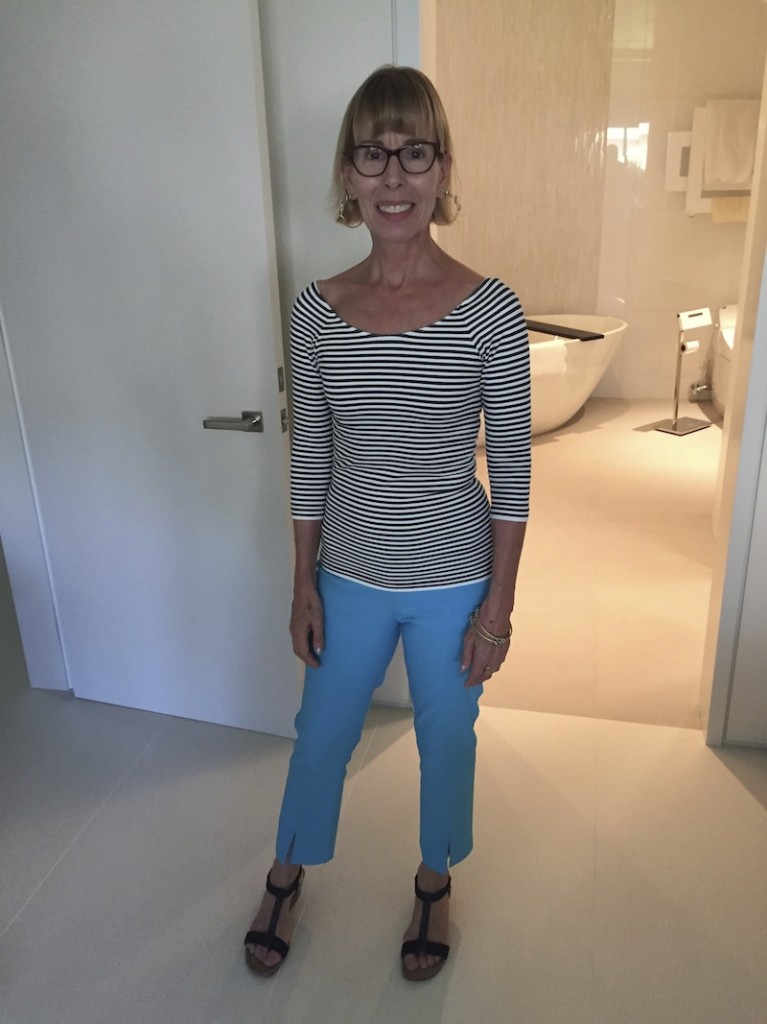 striped ¾ length shirt, blue pants with slit
