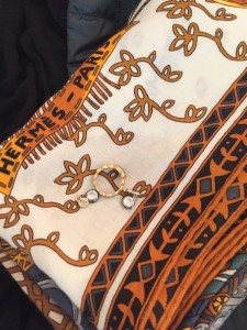  gold crystal drop earrings, gold ring, hermes black orange mixed print scarf