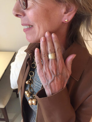 gold stud earrings, gold ring, gold and toroise statement necklace