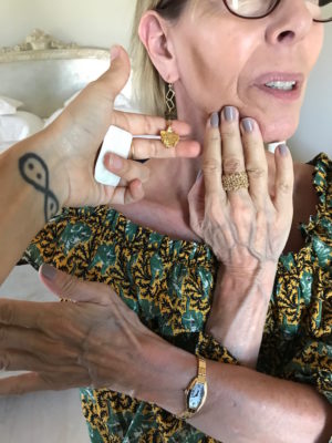 gold stone drop earrings, gold woven ring, gold watch