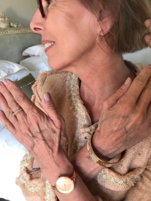 gold open hoop earrings, gold and crystal crossover ring, gold watch, gold bangle