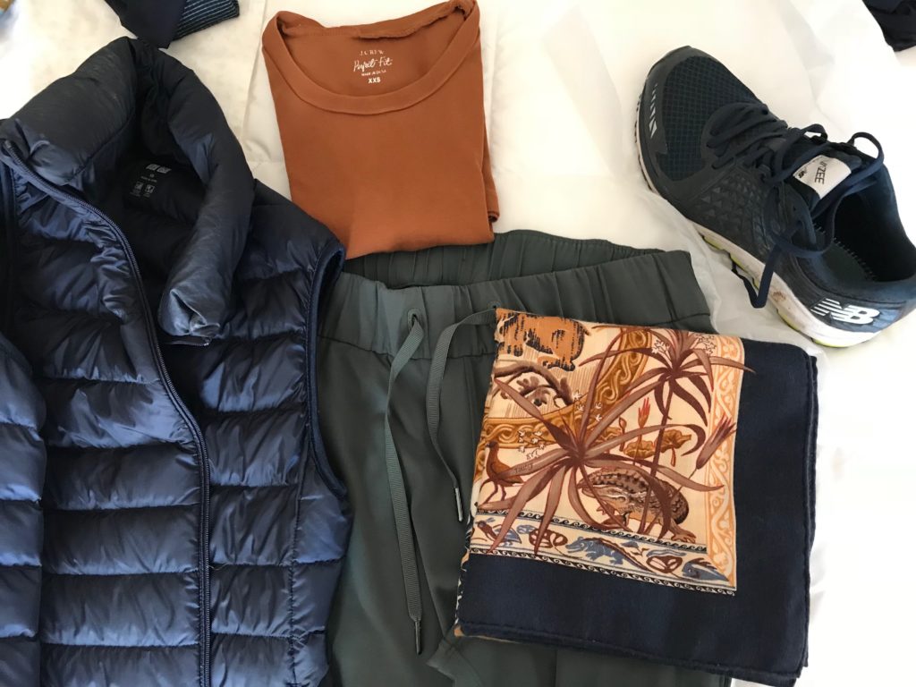 j.crew orange top, uniqlo navy blue zip up vest, blue multi-color print scarf, new balance navy blue sneakers