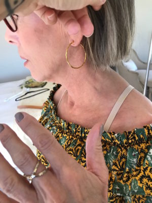 gold hoop earrings, gold crossover ring