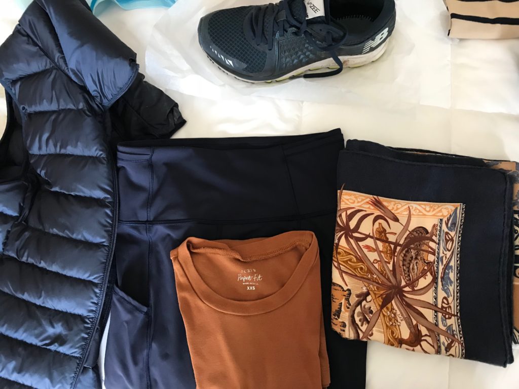 j.crew orange top, lululemon navy blue leggings, uniqlo navy blue vest, navy blue multi-color print scarf, new balance navy blue sneakers