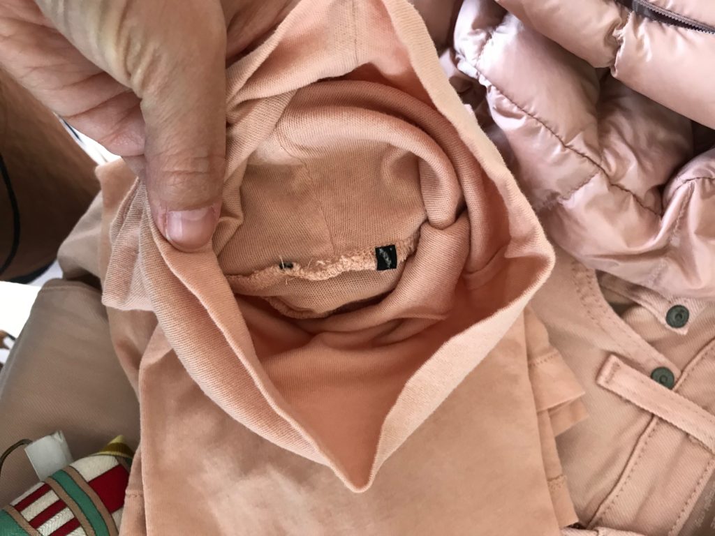 light pink turtlenck, light pink long sleeve top