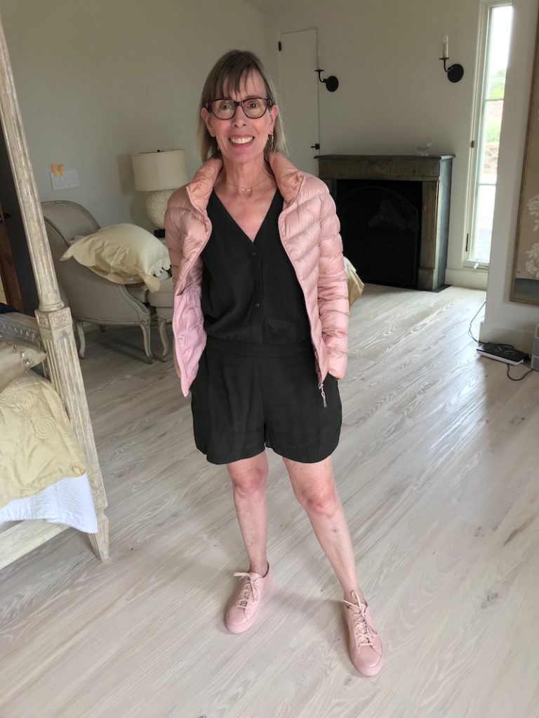 dark green sleeveless jumpsuit, dark green short jumpsuit, pink puffer jacket, beige puffer jacket, beige sneakers