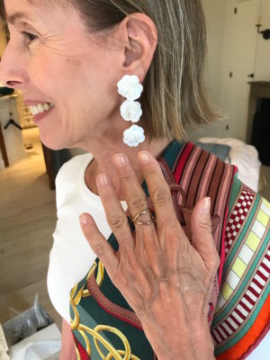 white flower drop earrings, gold crossover ring