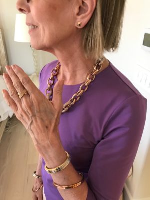 large gold chain necklace, gold bangles, gold pyramid stud earrings