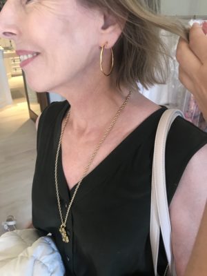 gold hoop earrings, gold pendant necklace