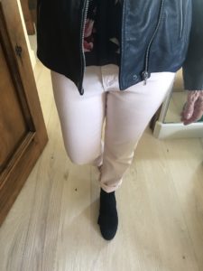 light pink jeans, black boots