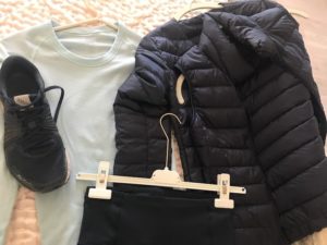 black pants, black puffer jacket, black puffer vest, sea foam green long sleeve shirt, New Balance black sneakers