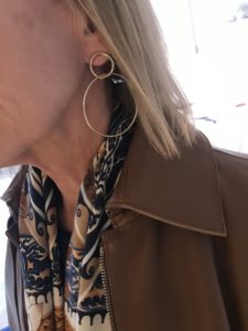gold double hoop earrings, multi color scarf, brown coat