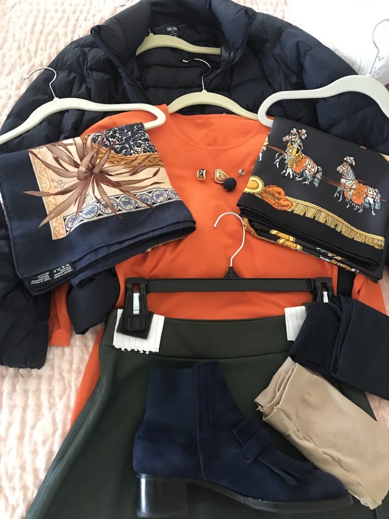 Worth orange long sleeve shirt, Kate Spade olive green skirt, nude Carbon leggings, Navy Carbon leggings, navy earrings, navy and gold earrings, lion earrings, navy printed scarf, Uniqlo navy puffer coat, Gravati navy blue booths with fringe