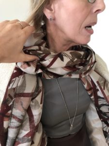 grey top, brown and gray printed scarf, long silver necklace
